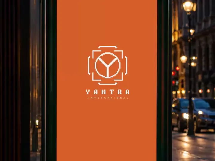 Yantra brand film playing on a street billboard at night
